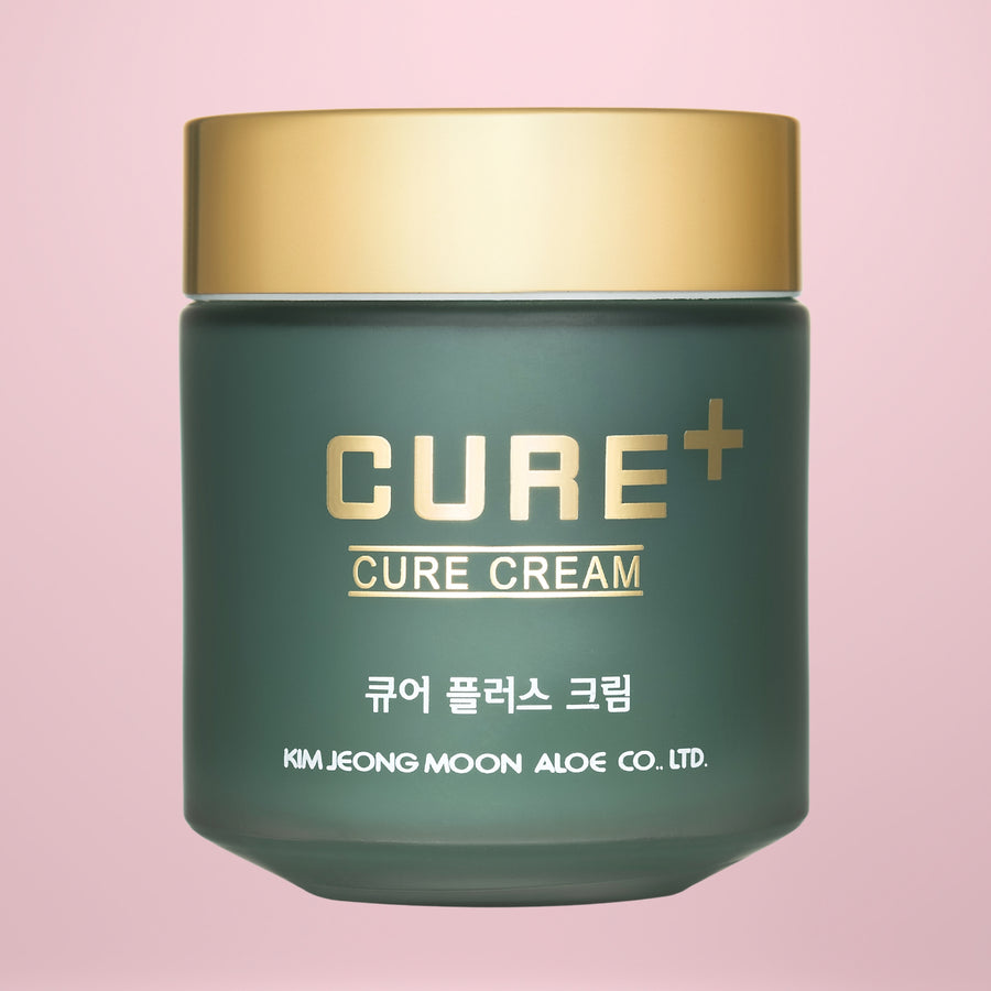 Cure Cream jar with gold lid on a pink background
