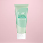 Tube of Cure Hydro-Green Aloe Foam Cleanser on a pink background
