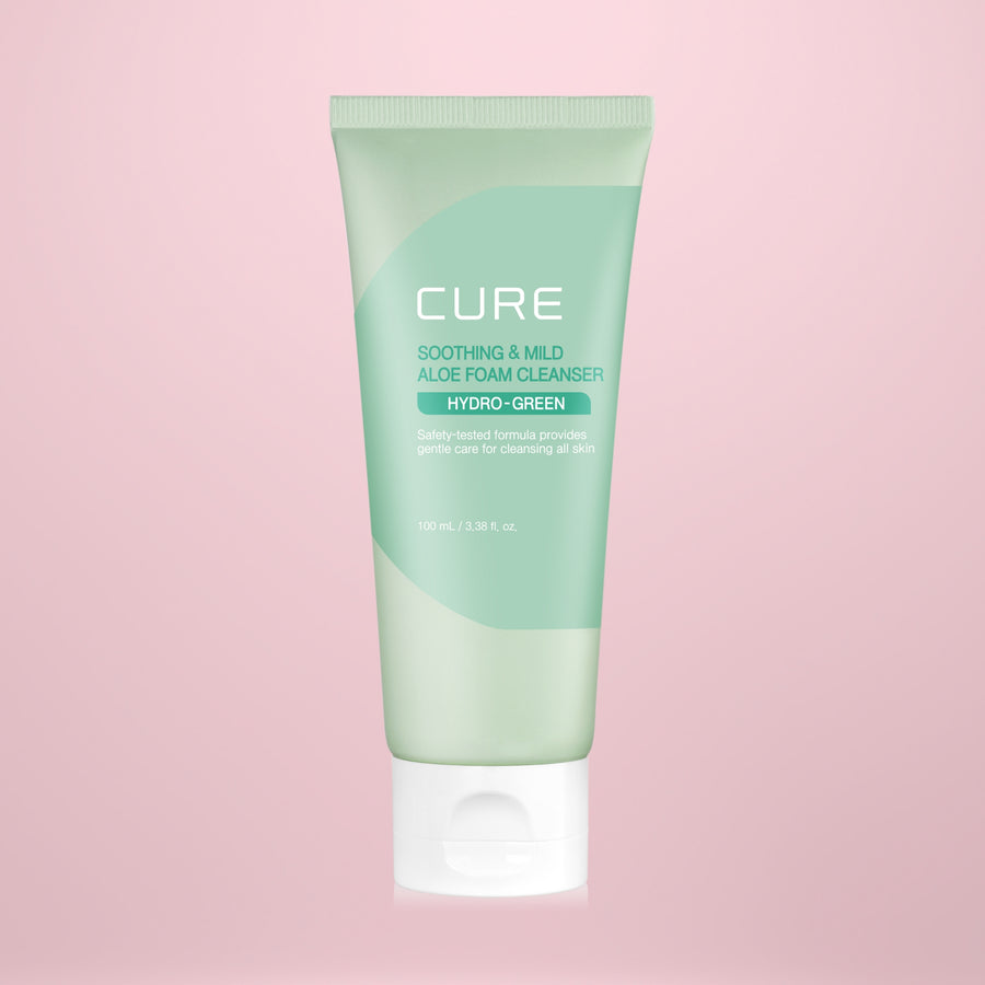 Tube of Cure Hydro-Green Aloe Foam Cleanser on a pink background