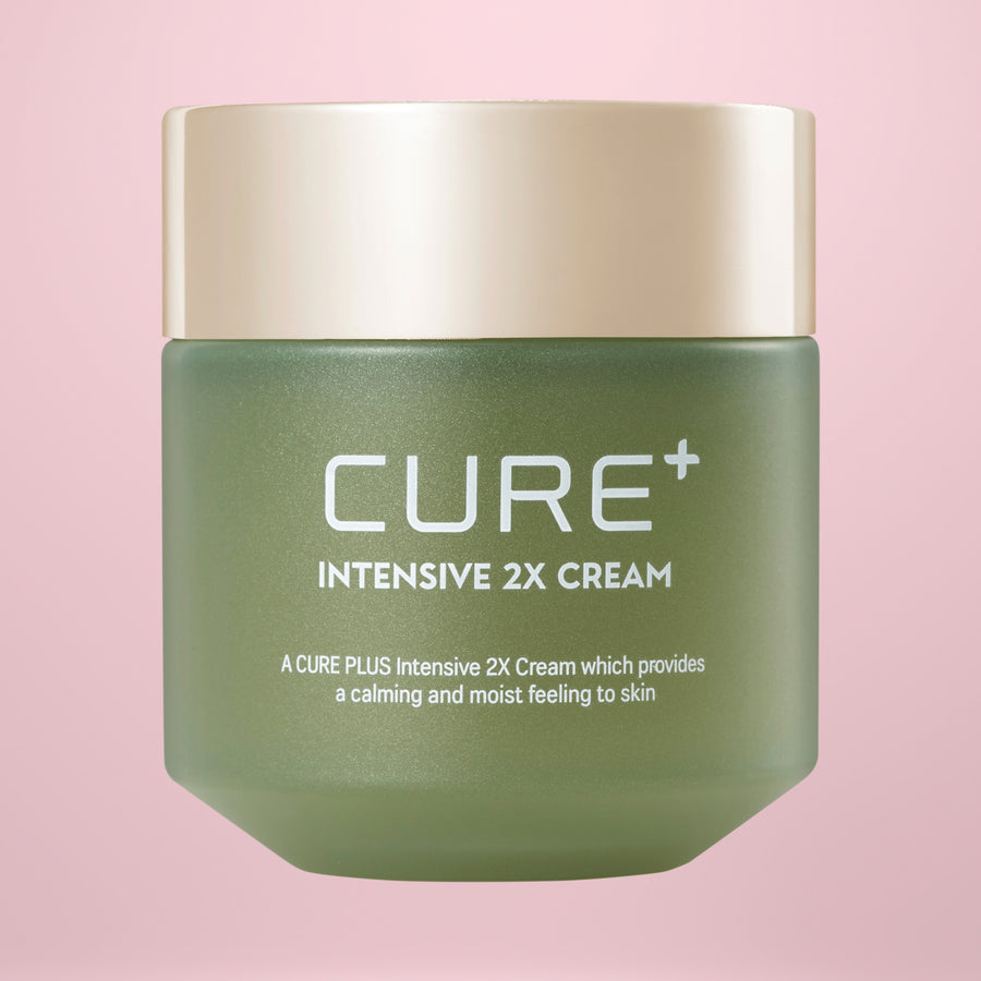 Green jar of Cure Intensive 2X Cream 50g on a pink background
