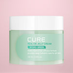 Jar of Cure Realoe Jelly Cream Hydro-Green 100ml on a pink background